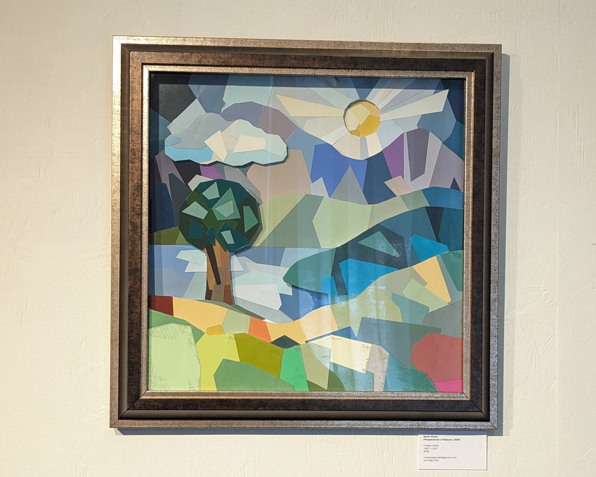 Framed artwork featuring colors and shapes showing a nature landscape with tree, hills, lake, mountains and sun. 